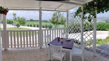 Triple Room, Multiple Beds, Patio, Pool View | Outdoor dining