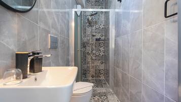 Shower, hair dryer, slippers, towels
