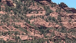 A rugged mountain landscape with rocky formations and sparse vegetation. - 1-bedroom condo in Sedona Arizona (Sedona)