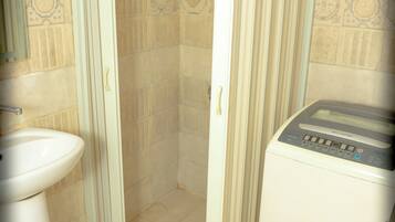 Bidet, towels, soap, toilet paper