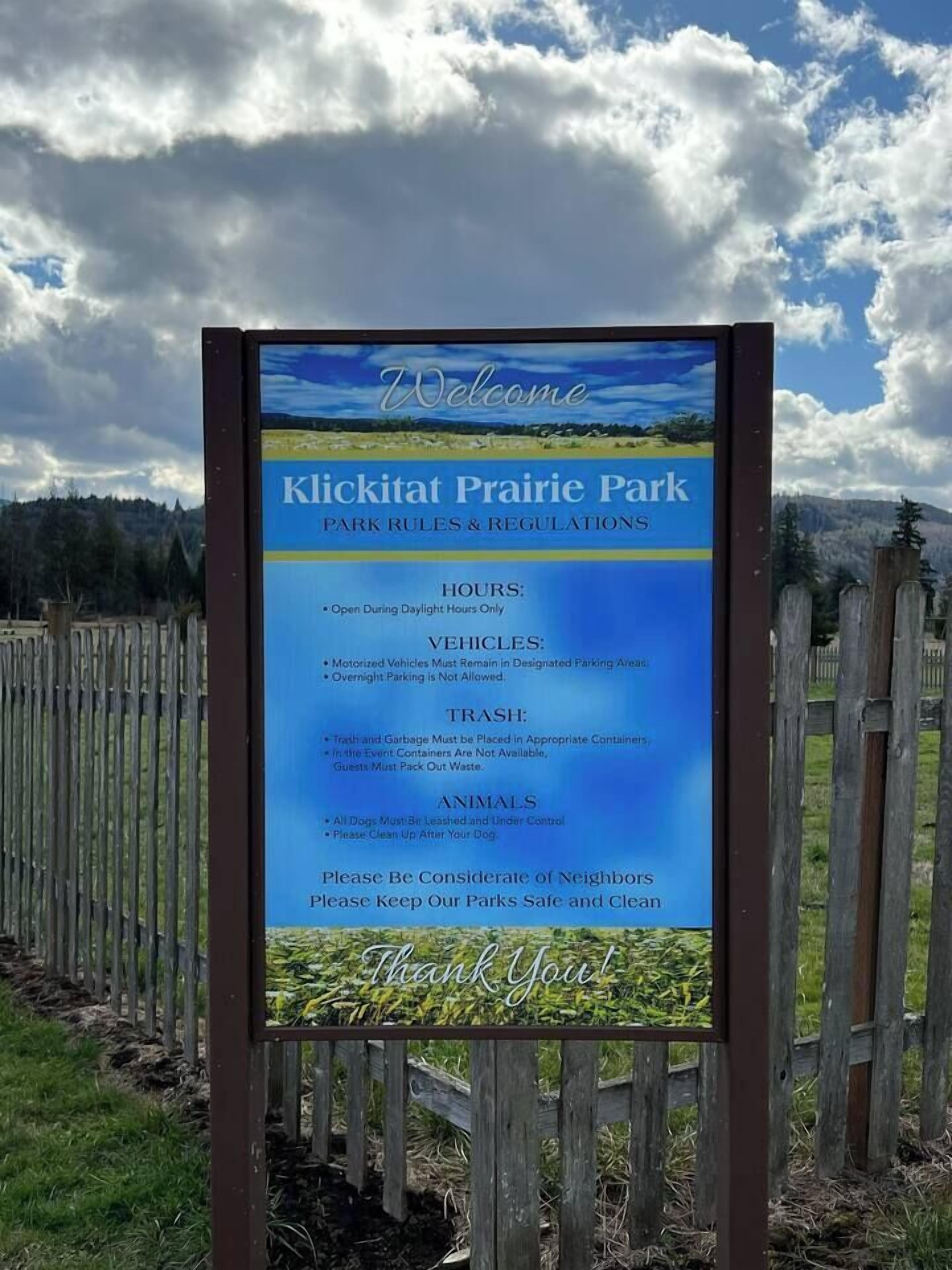 A signboard with park rules and regulations for Klickitat Prairie Park.