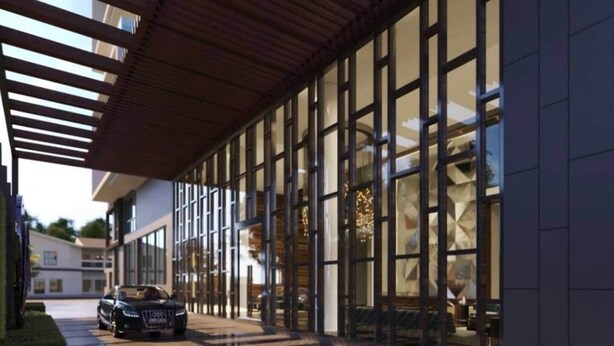 A modern building with large windows, a covered walkway, and a parked car. - Solaris Luxury Residence | Osu • Pool • Gym (Accra)