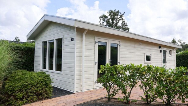A single-story building with a flat roof, large windows, and a door. - Holiday Home in Velsen-zuid With Terrace (Velsen-Zuid)