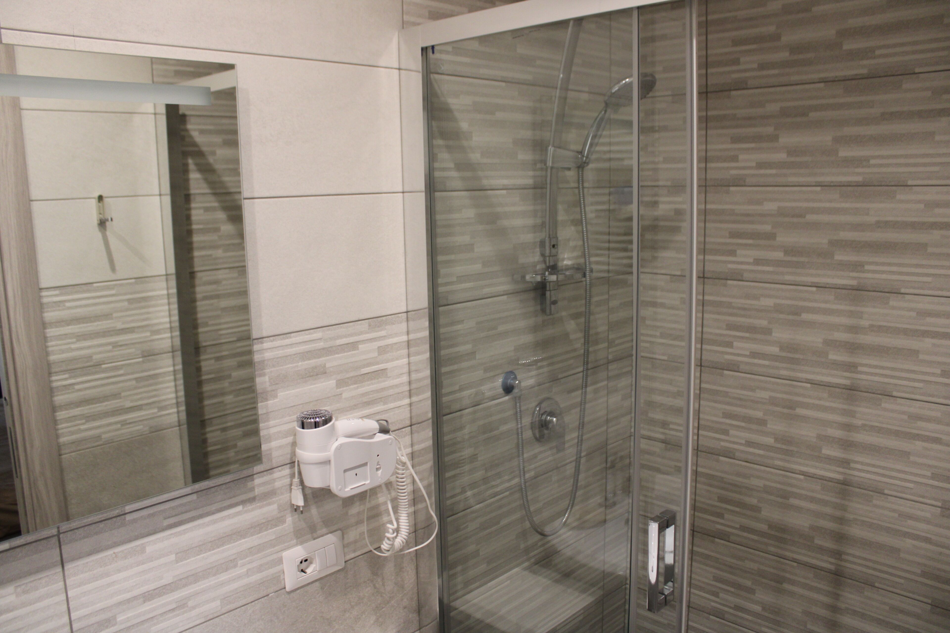 Family Quadruple Room | Bathroom | Shower, hair dryer, towels, soap