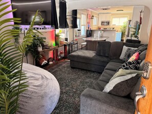 Living area - NEW! Vibe City Retreat: Luxe Hot Tub, Backyard Games, & Prime Vibe Sleeps 20! (Denver)