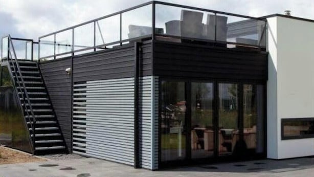 A modern building with a glass entrance, a staircase, and a flat roof. - Holiday Home in Nijkerk With Terrace (Nijkerk)