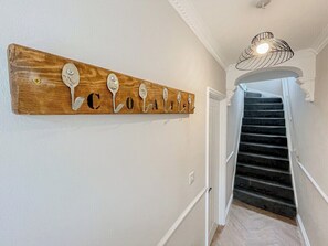 A wooden wall-mounted sign with spoon-shaped letters spelling 'COATELLO'. - Mulberry House - close to BPW and Brecons (Dowlais)