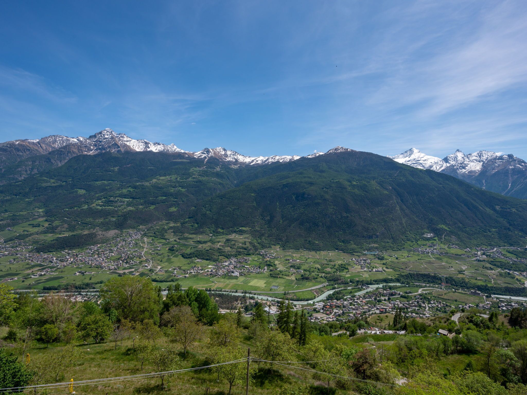 A mountainous landscape with a valley town.