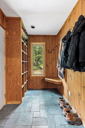 A wooden interior with a window, shelves, and a bench. - New Listing! Peaceful 3-bedroom condo in Stowe - access to the Rec Path and more (Stowe)