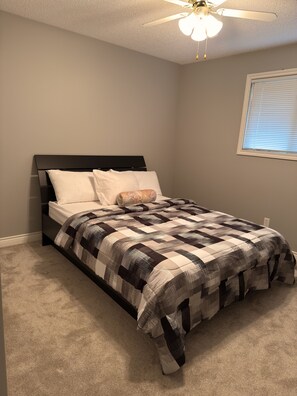 Desk, iron/ironing board, free WiFi, bed sheets - Dr Pizzle Guest House|| Home Away from Home (Saskatoon)