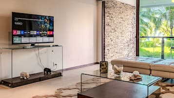 Apartamento luxo, vista para a praia | Área de estar