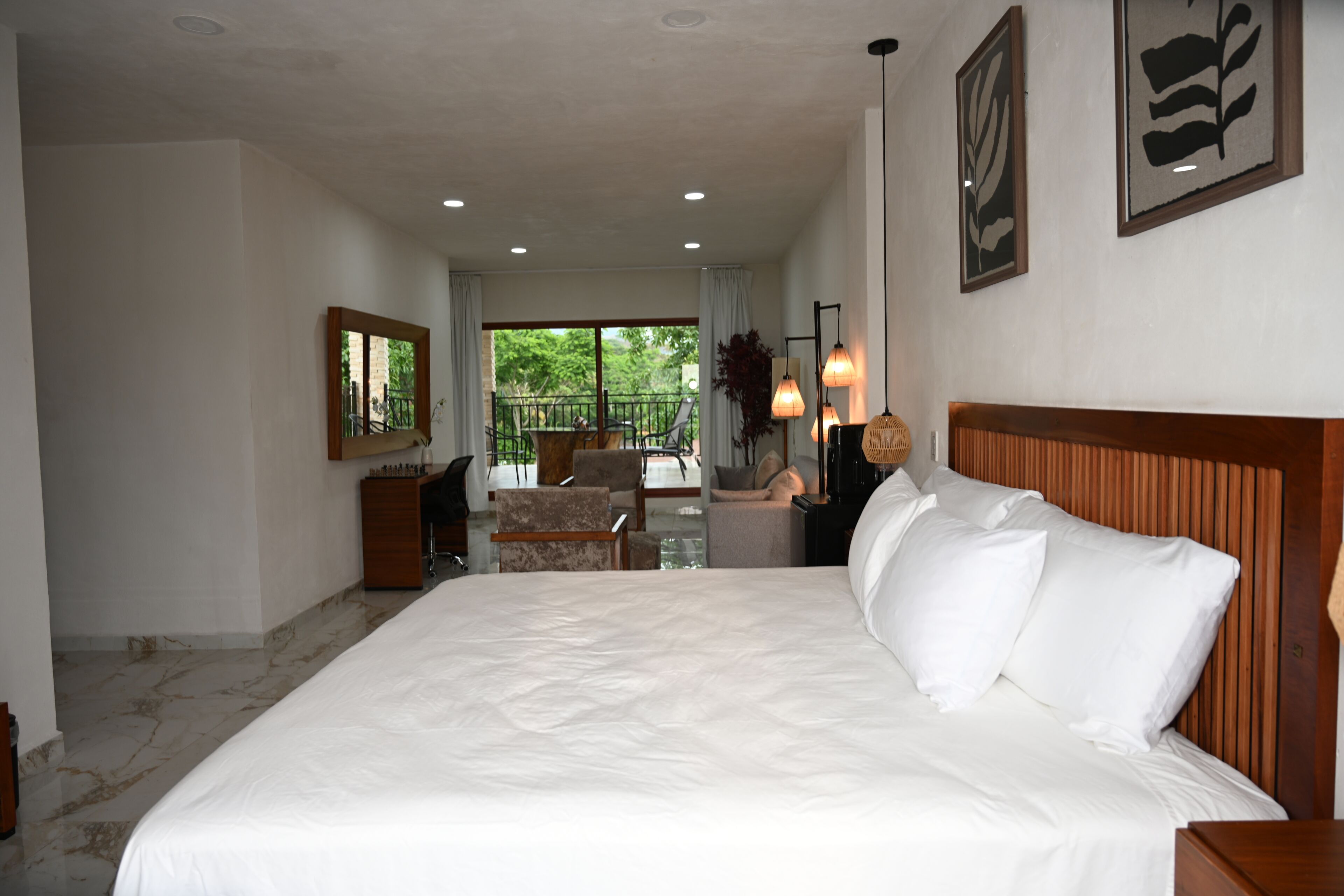 Luxury Suite, Garden View | In-room safe, desk, laptop workspace, iron/ironing board
