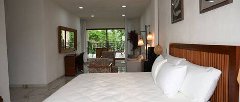 Luxury Suite, Garden View | In-room safe, desk, laptop workspace, iron/ironing board