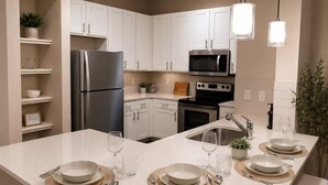 Coffee/tea maker, fridge, microwave, oven