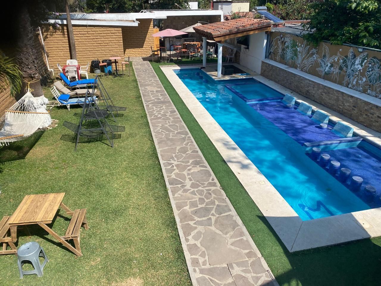 Outdoor pool, open 9:00 AM to 9:00 PM, pool umbrellas, pool loungers