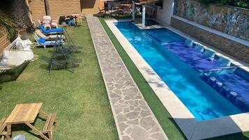 Outdoor pool, open 9:00 AM to 9:00 PM, pool umbrellas, pool loungers