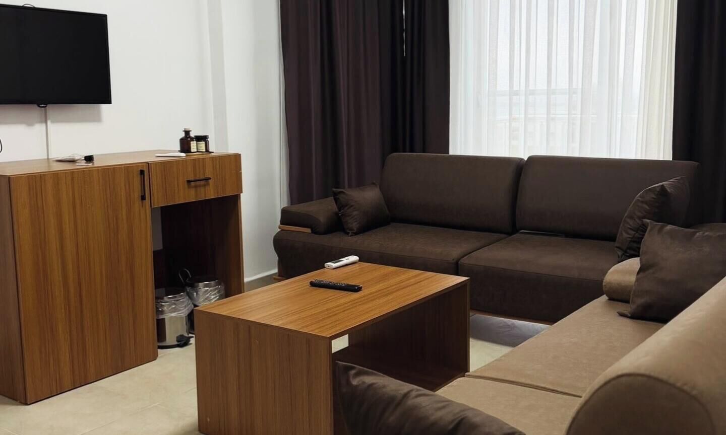 Basic Quadruple Room, Sea View | Living area