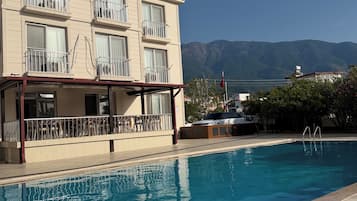 Outdoor pool, open 9:00 AM to 9:00 PM, free cabanas, sun loungers