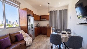 A modern apartment with a kitchen, dining area, and living space. - Hidden Gem 1BR Near Romantic Zone (Puerto Vallarta)