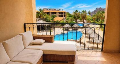 Ocean-view 1BR condo with pool, AC, kitchen, and washer/dryer.