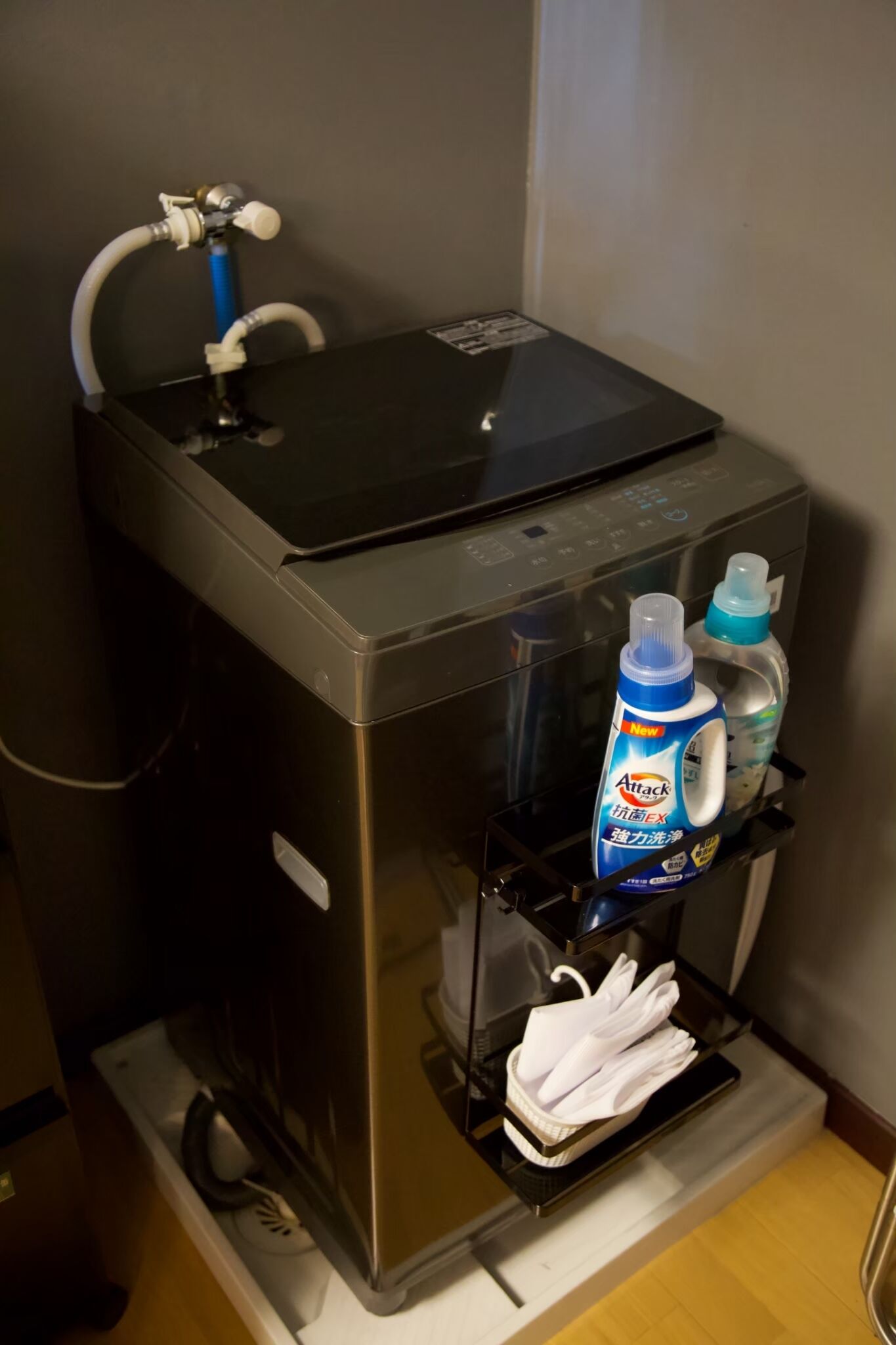 A self-service beverage dispenser with a bottle of hand soap and a bottle of hand sanitizer.