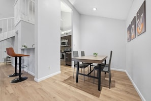 A modern kitchen with a microwave, oven, and sink. - Contemporary Home at South Lamar with yard and parking (Austin)