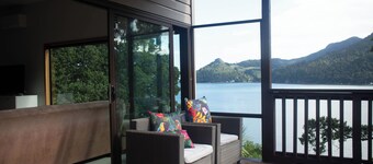 Te Whare Huia - a stunning spacious home right on beautiful Huia Bay.