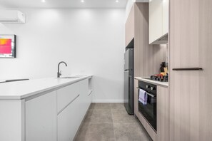 Private kitchen - Fresh 2BR Stay | Parking | 7min Walk to Tram (Dickson)