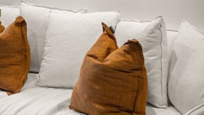 A room with a white bed, a framed abstract painting, and a white wall. - Terrace Studio Retreat w/ BBQ & AC (Braddon)