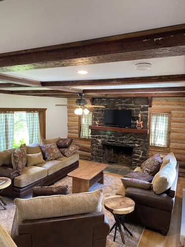Fully Restored  3-bedroom log cabin in Tupper Lake perfect for relaxing stays.