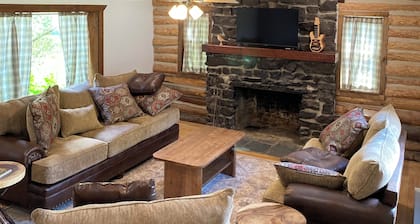 Fully Restored 3-bedroom log cabin in Tupper Lake perfect for relaxing stays.