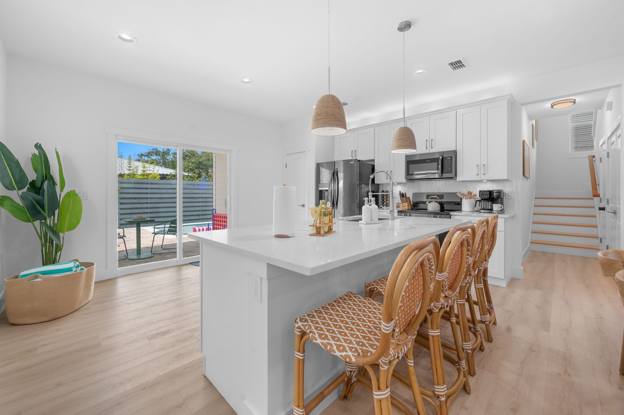 Bright modern kitchen with large island seating and patio access