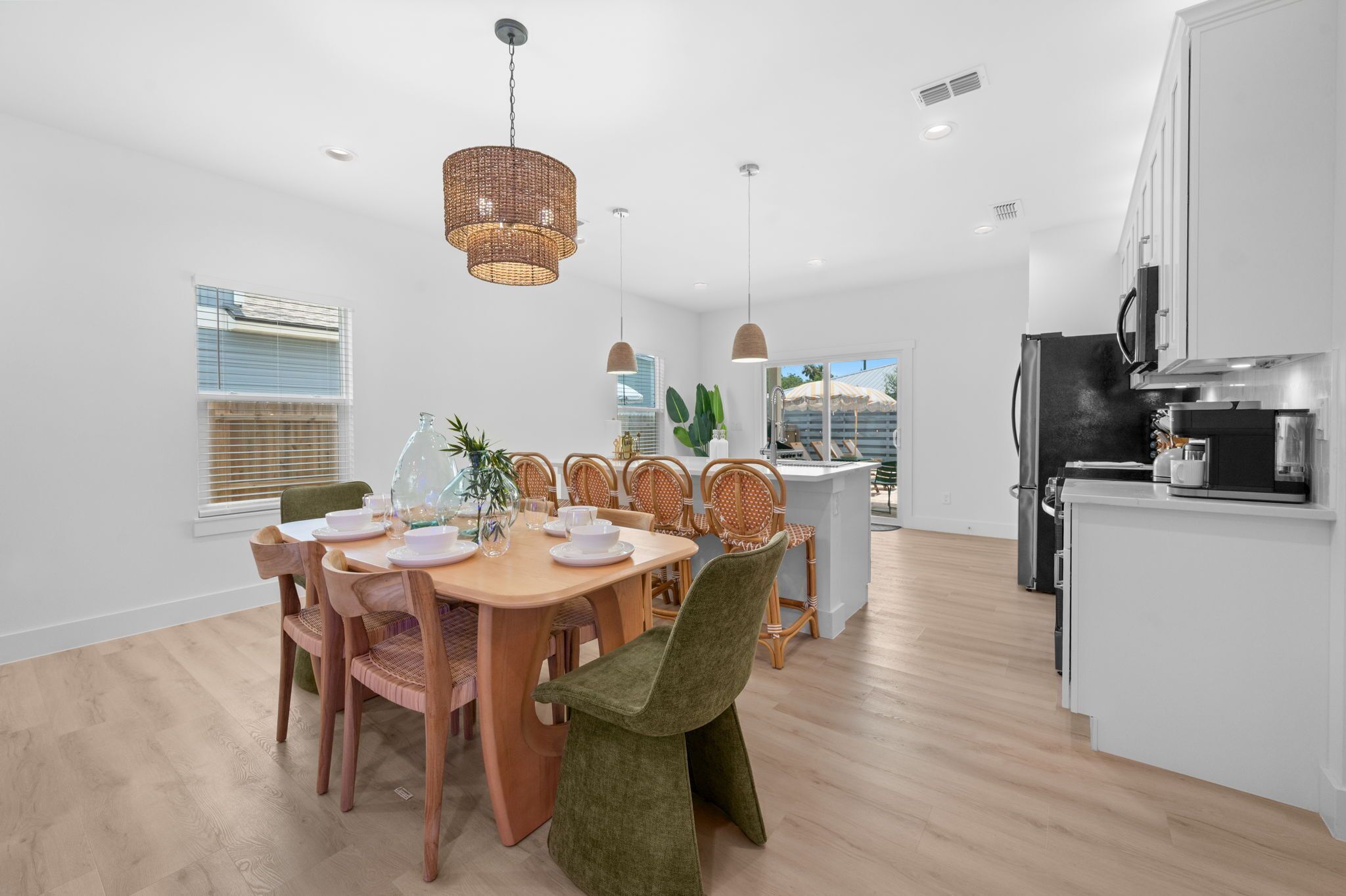 Bright open dining & kitchen space with stylish seating and breakfast bar