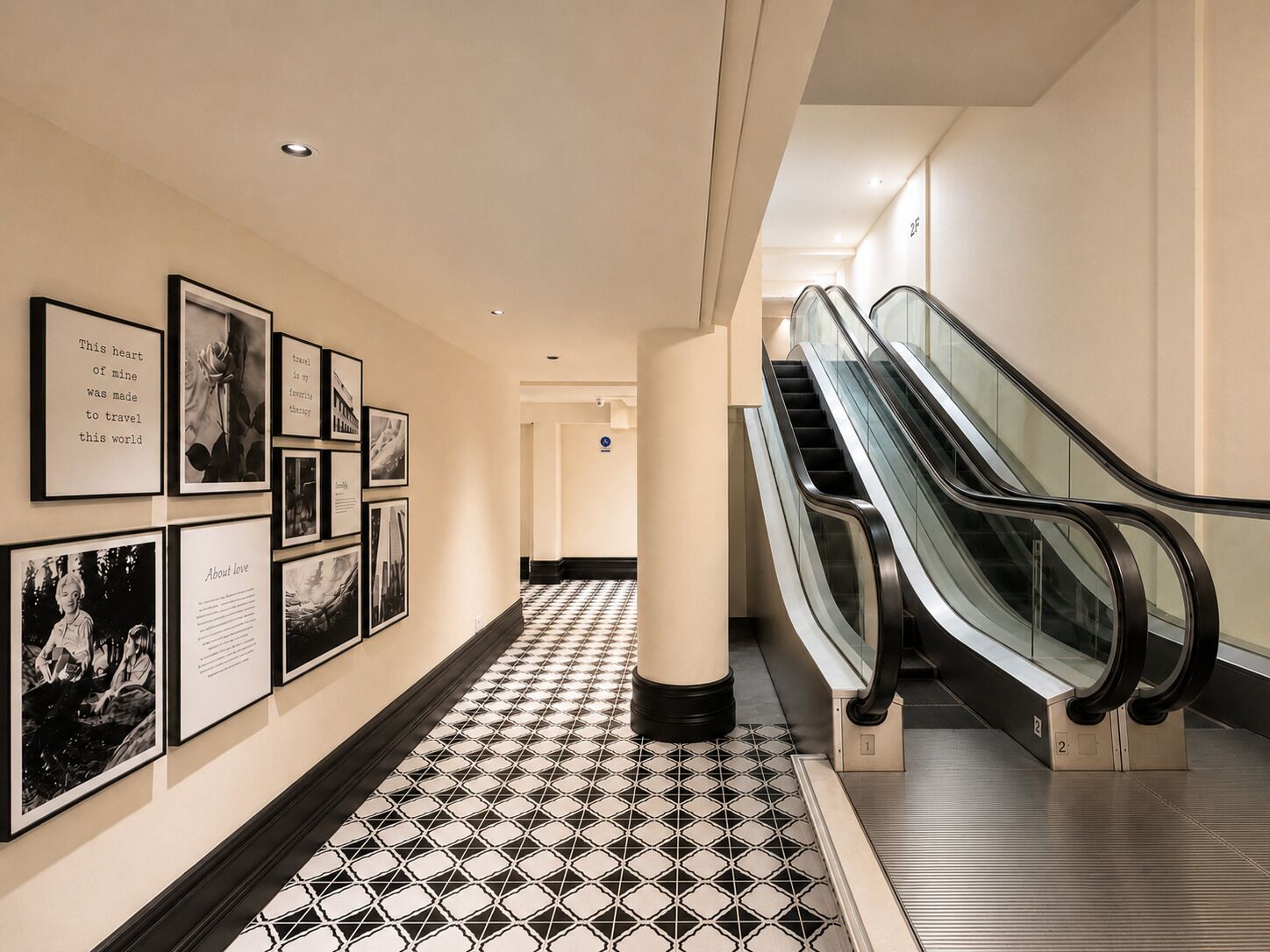 A hallway with framed pictures on the wall, a tiled floor, and an escalator.