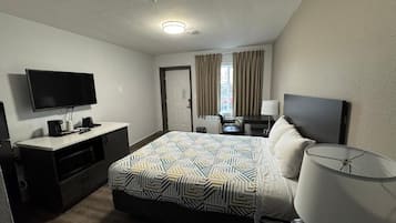 Tabla de planchar con plancha, wifi gratis y ropa de cama