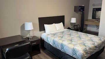 Tabla de planchar con plancha, wifi gratis y ropa de cama