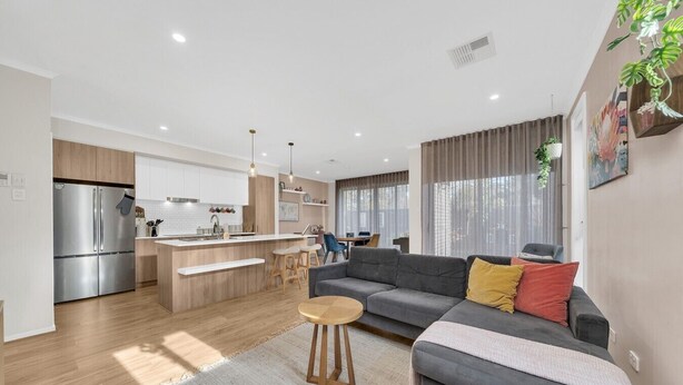 A modern apartment with a kitchen, dining area, and living room. - The Barker Base | Gateway to the Hills (Mount Barker)