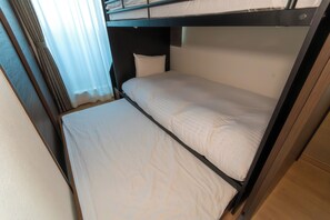 A bunk bed with a pillow and a headboard. - Kag.R Ohori 3  (Fukuoka)