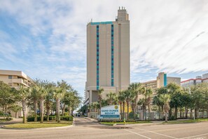 A tall hotel building with a sign for Sand Dunes Resort. - Amazing OceanView•14th-Fl• Spacious 3BR •Fireplace •Pool• Sleeps 10 (Myrtle Beach)