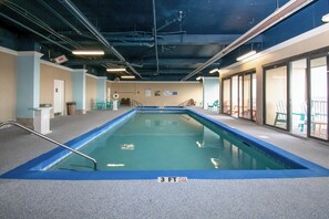 An indoor swimming pool with a blue border, a lifeguard station, and a no diving sign. - Amazing OceanView•14th-Fl• Spacious 3BR •Fireplace •Pool• Sleeps 10 (Myrtle Beach)