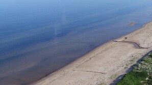 A coastal landscape with a sandy beach and calm water. - Skummeslöv Beach Home B, Skummeslövstrand, Sweden (Skummeslövstrand)