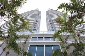 A high-rise building with a symmetrical facade, large windows, and a central entrance. - Fully-Equipped 2BR Home in Santa Clara – Extended Stays Only (30+ Nights) (Río Hato)