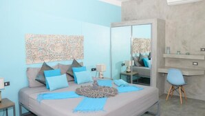 A modern bedroom with a bed, a mirror, a desk, and a chair. - Wantana villa Sawaree villa 1 V308 (Chang Wat Surat Thani)