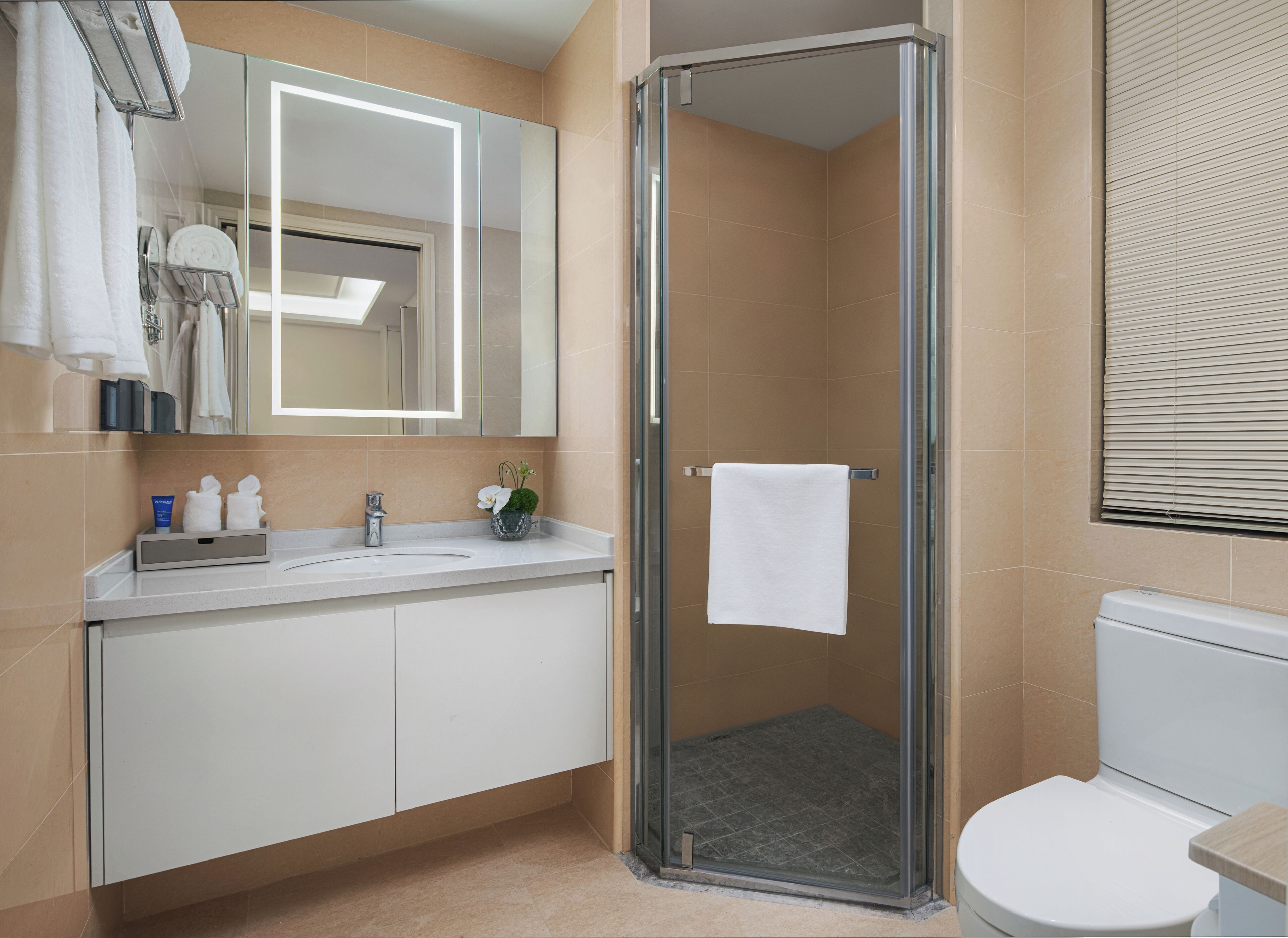 Shower, hair dryer, slippers, towels