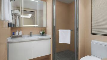 Shower, hair dryer, slippers, towels