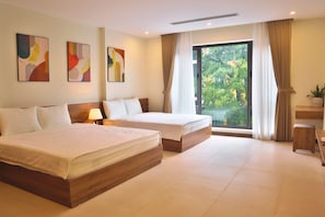 Executive Quadruple Room, City View | Minibar, desk, laptop workspace, blackout drapes - GAO SUITES (Hoan Kiem)
