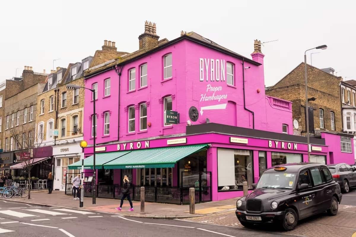 A pink building with the name 'BYRON' and 'Proper Hamburgers' on the facade.