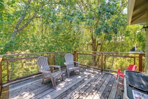 A wooden deck with Adirondack chairs and a grill. - Walk to Main St! Quiet Mendocino County Retreat (Willits)
