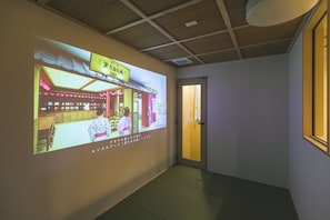 A hallway with a projection of a traditional Japanese restaurant interior.