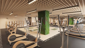 A modern gym with exercise equipment, a green vertical garden, and wooden flooring. - Holiday Inn & Suites Tijuana Downtown by IHG (Tijuana)